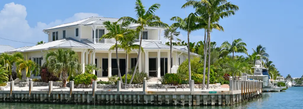 Canal front home with docked boats in Gulf Cove, Florida