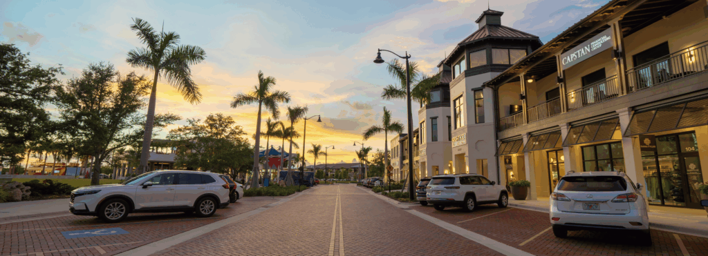 Downtown Wellen Park shops and palm lined streets at sunset