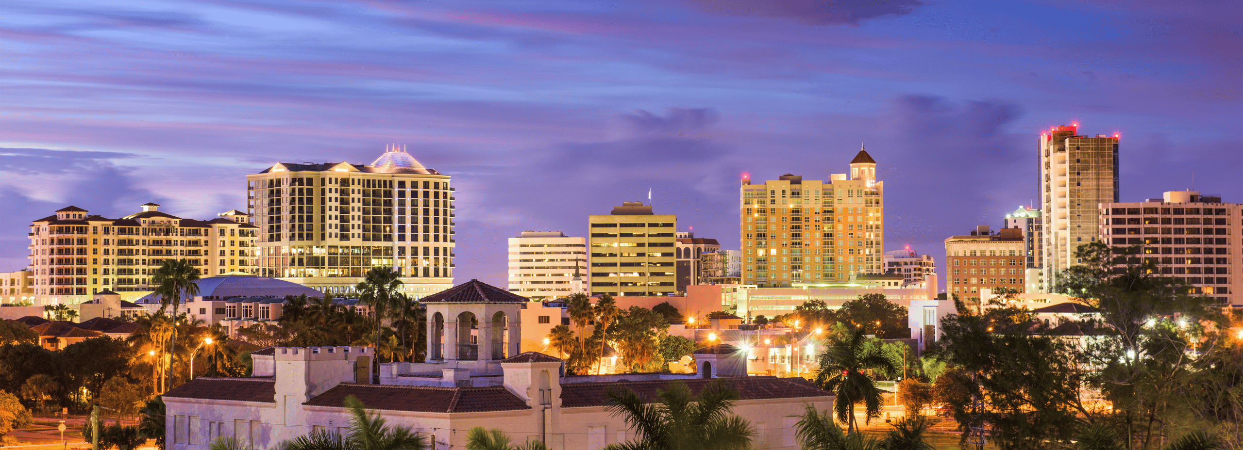 Downtown Sarasota skyline illuminated at dusk in Southwest Florida