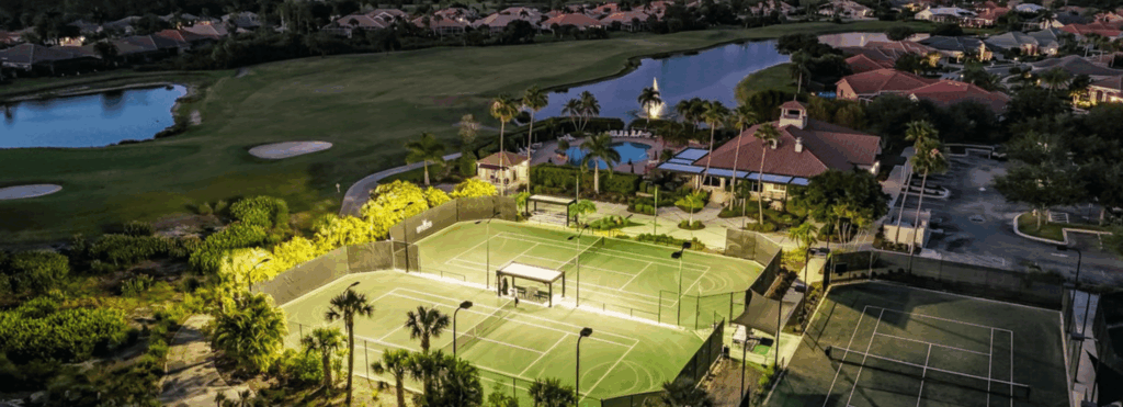 Aerial view of tennis courts, golf course, and homes in North Port, Florida